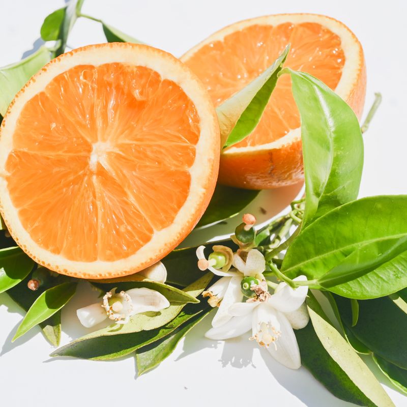 Orange Blossom Hand Cream tube on a tiled surface